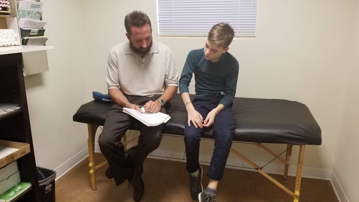 Dr. Damanti with a patient